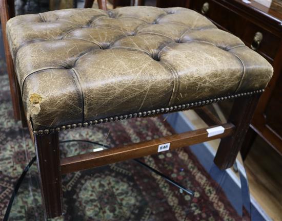 A leather button stool, W.58cm